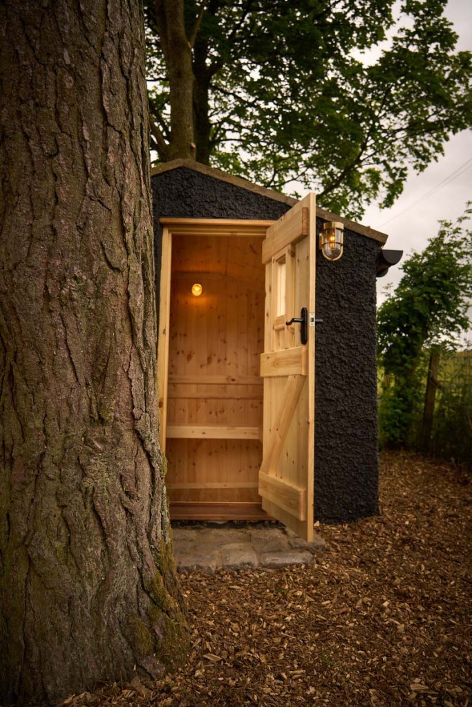 Looking into Hadrian's Wall Huts Sauna from the outside through the door in Northumberland